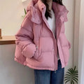 Dusty pink hooded puffer jacket with a high funnel neck, quilted insulation, and a relaxed fit for easy layering.
