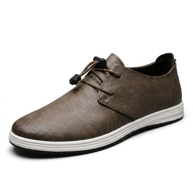 Side profile of a brown leather lace-up sneaker with white sole on a plain white background