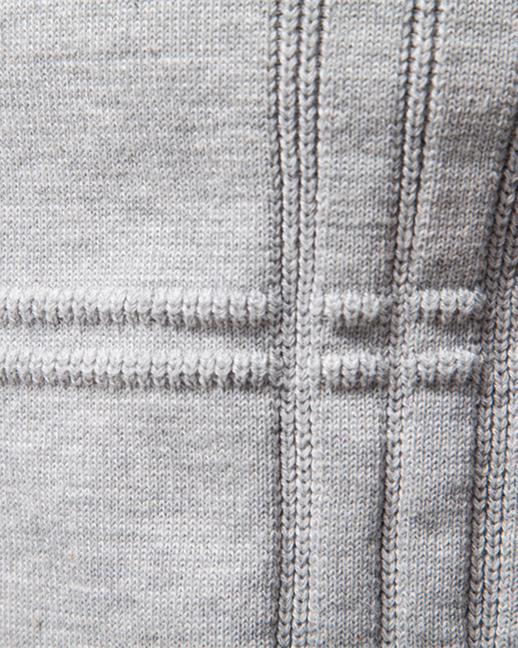 Close-up of light grey knit sweater textured stripe pattern