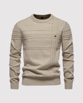 Flat lay of beige ribbed knit sweater with crew neckline