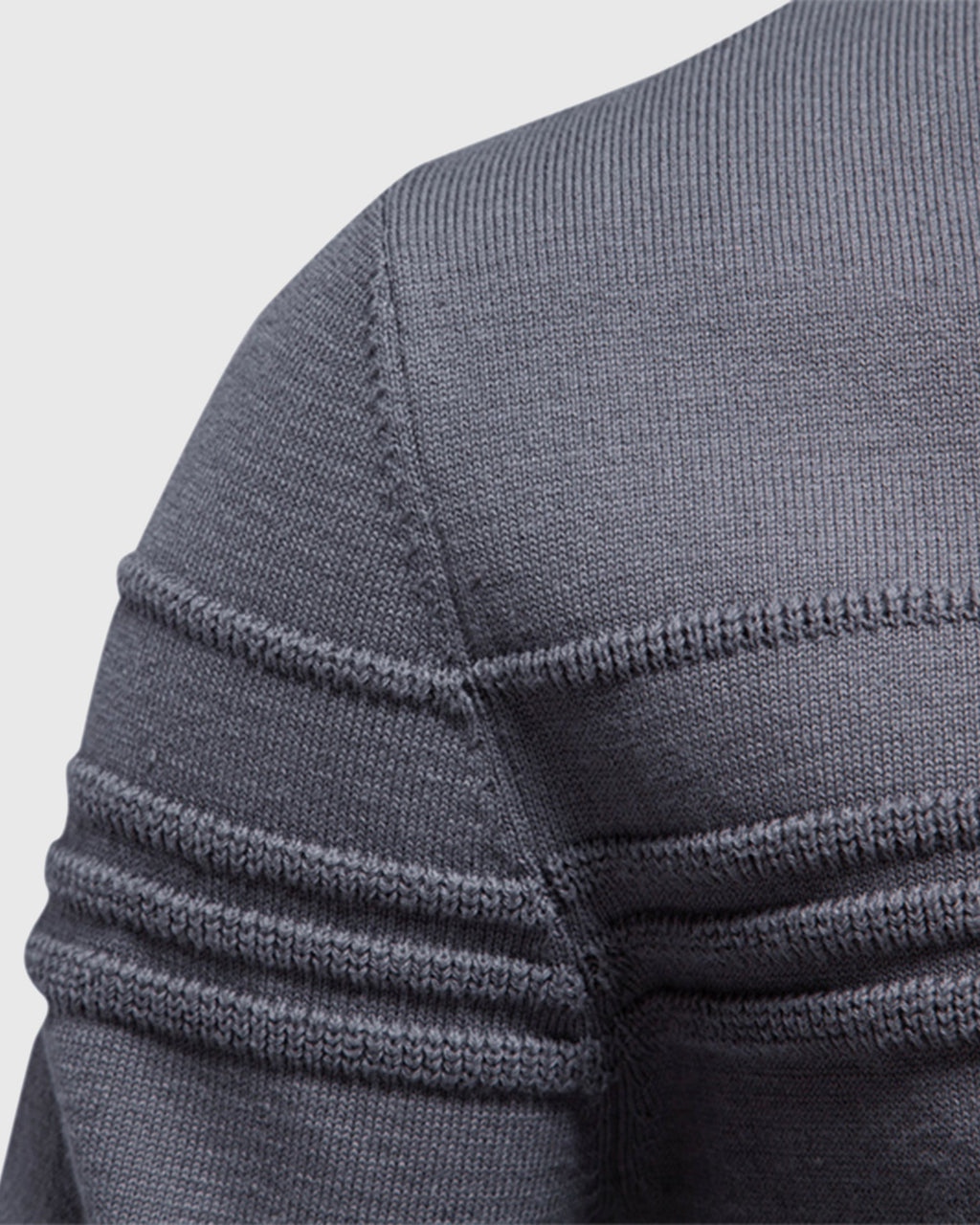 Close-up of the gray crew neck sweater highlighting the textured shoulder knit and ribbed sleeve design.