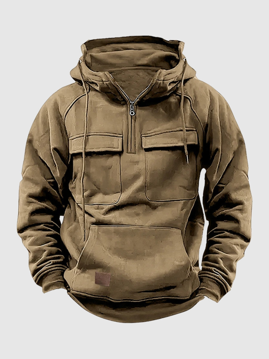 Khaki tactical pullover hoodie with a half-zip stand collar, adjustable hood, flap chest pockets, and front kangaroo pocket displayed on a white background.