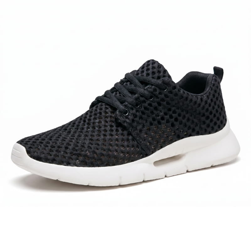 Side profile of a black mesh sneaker with white cushioned sole on a plain white background