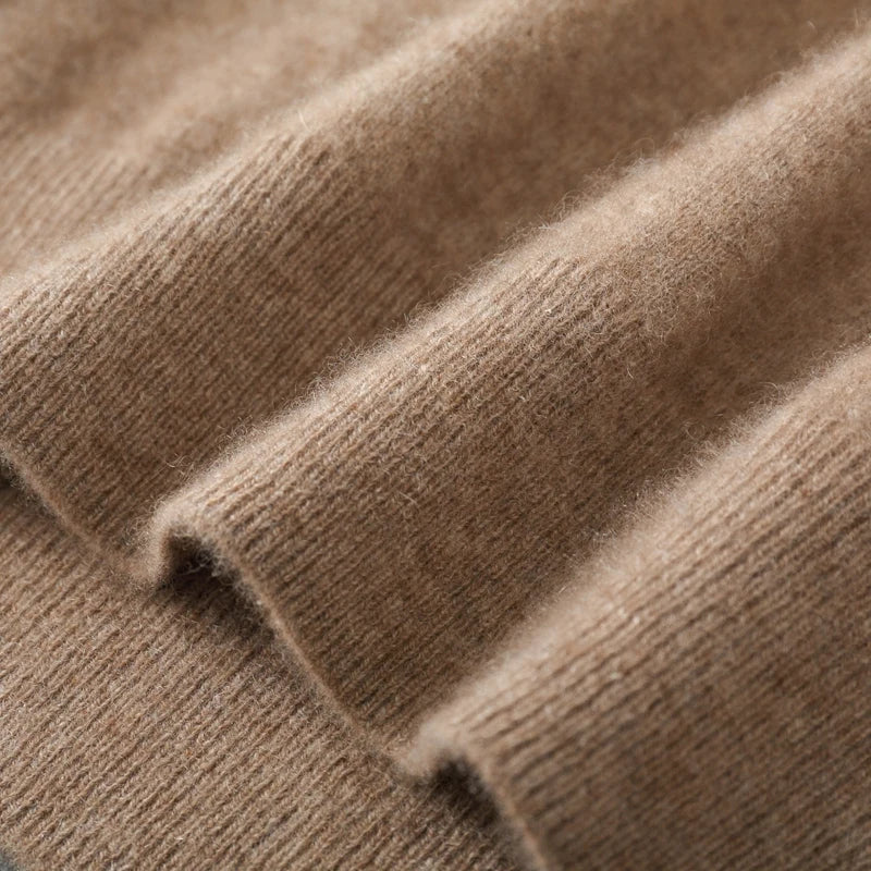 Close-up of the sweater vest ribbed hem and fine knit fabric texture.