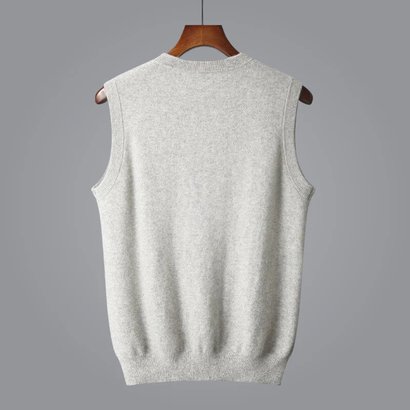 Men's white knit sweater vest featuring a V-neckline, sleeveless construction, and ribbed trim.