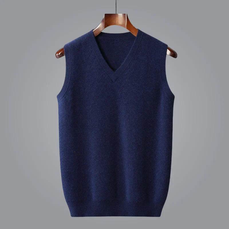 Men's navy blue knit sweater vest with a classic V-neck, ribbed hem, and sleeveless design.