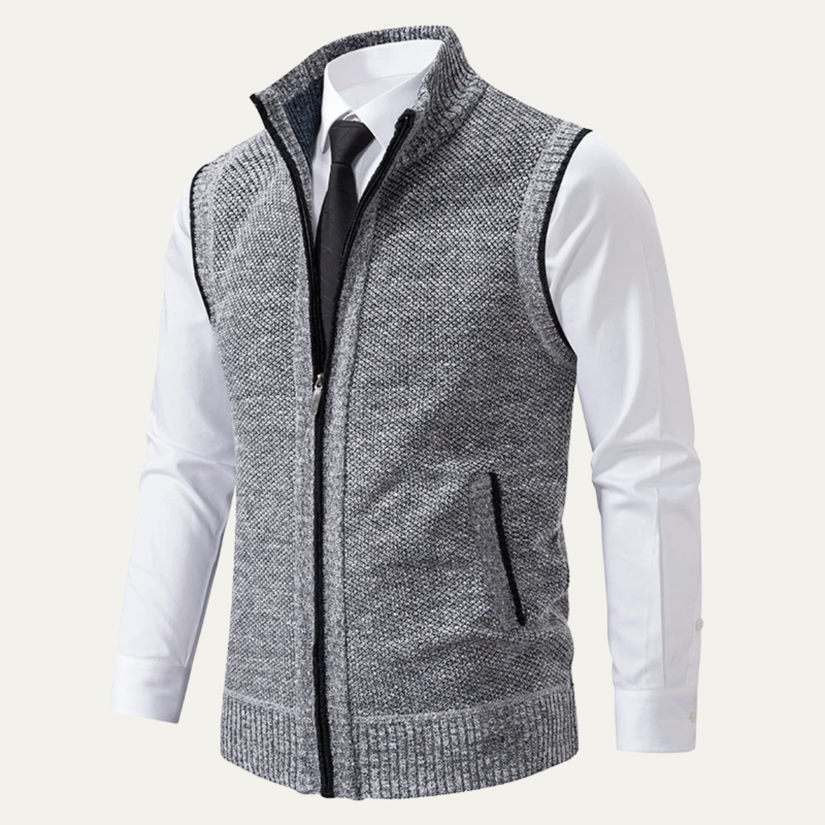 Men's gray knit zip-up sweater vest with a stand collar, sleeveless design, ribbed hem, and zip pockets layered over a white dress shirt and black tie.
