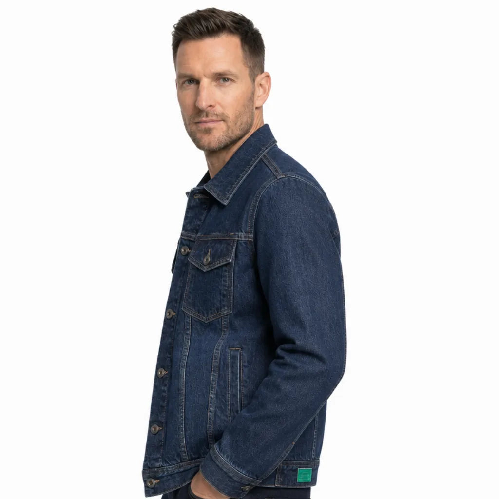 Side view of a man wearing a dark wash denim jacket featuring a button-front closure, pointed collar, and regular-fit silhouette.