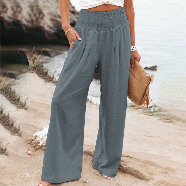 Women's gray high-waisted wide-leg linen pants with a relaxed fit and breathable fabric.