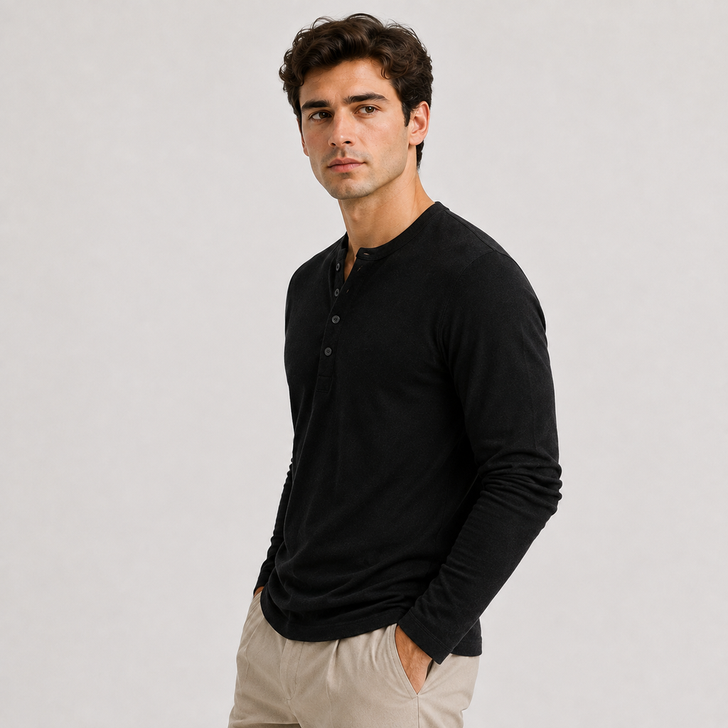 Side view of a man wearing a black long-sleeve Henley sweater with a three-button neckline and fitted silhouette.