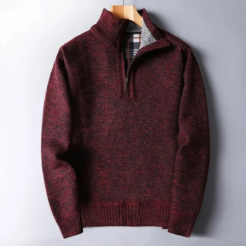 Burgundy quarter-zip sweater in a dense, textured knit with a mock neck and a soft, plaid-lined interior.