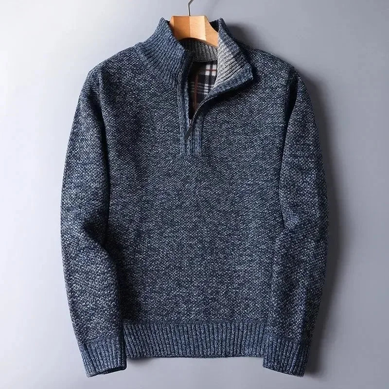 Navy blue heathered knit quarter-zip sweater with a mock neck, ribbed trim, and a plaid-lined interior.