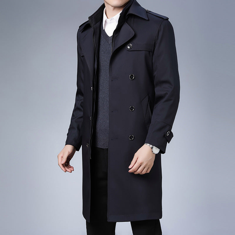 Navy blue double-breasted trench coat with notch lapels, shoulder epaulettes, and a structured, tailored fit.