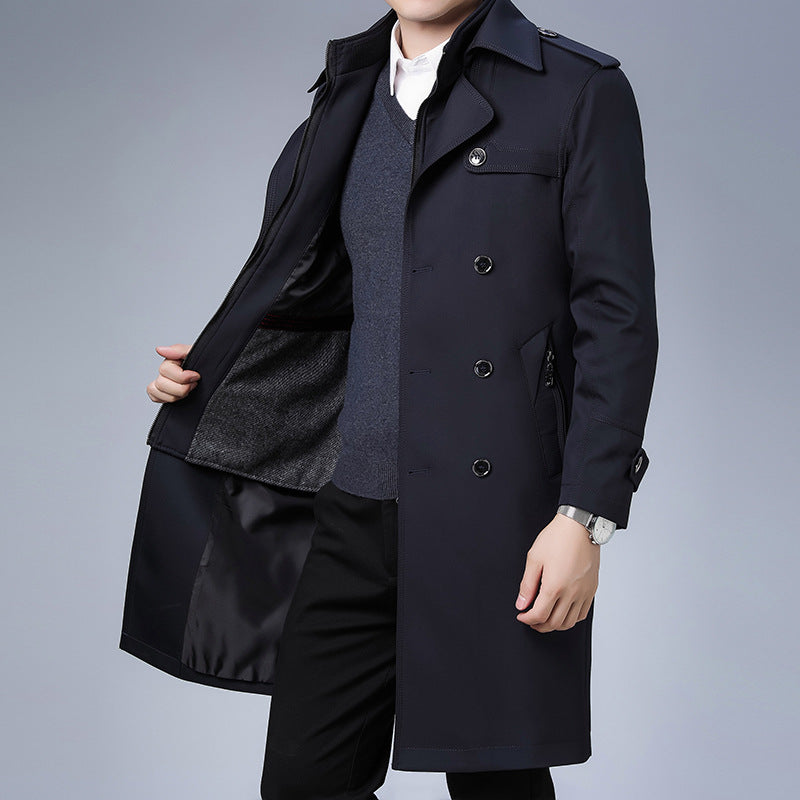 Navy blue double-breasted trench coat with notch lapels, shoulder epaulettes, and a smooth, structured water-repellent finish.