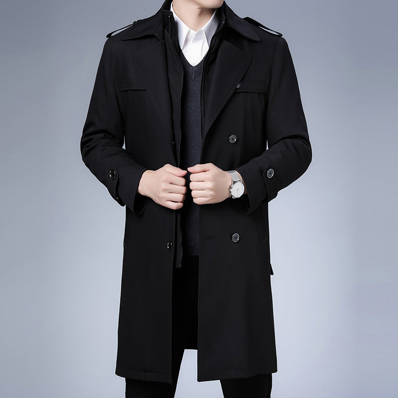 Black double-breasted trench coat with notch lapels, shoulder epaulettes, and button cuffs in a structured longline fit.