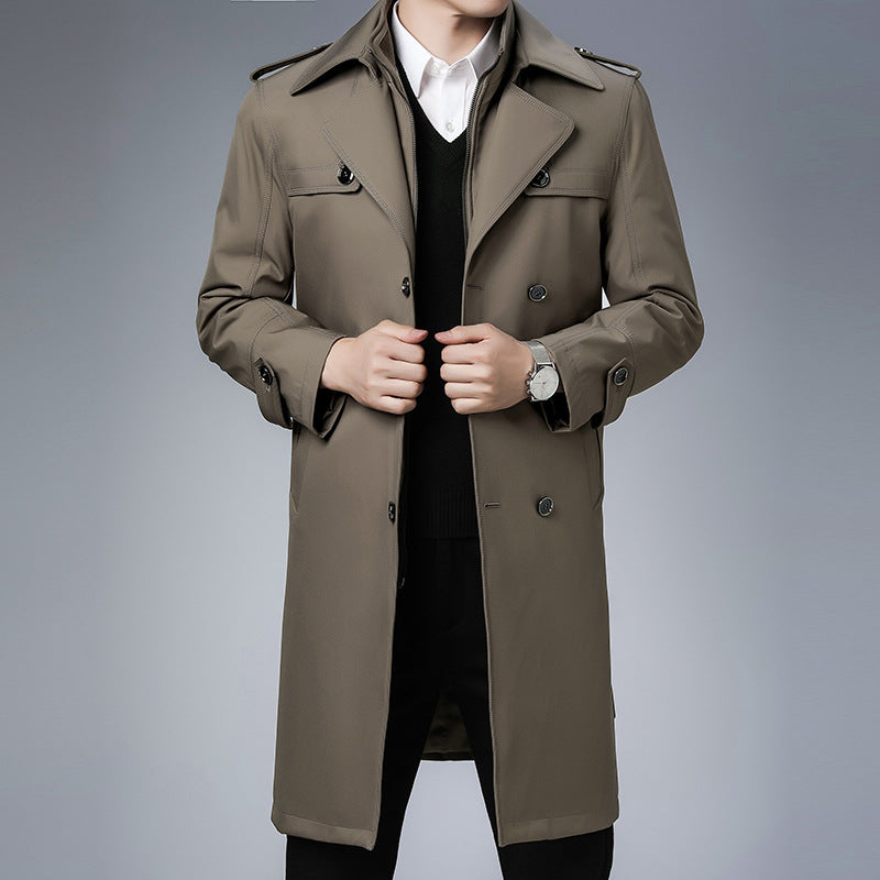 Taupe double-breasted trench coat with wide notch lapels, shoulder epaulettes, and button cuffs in a structured fit.