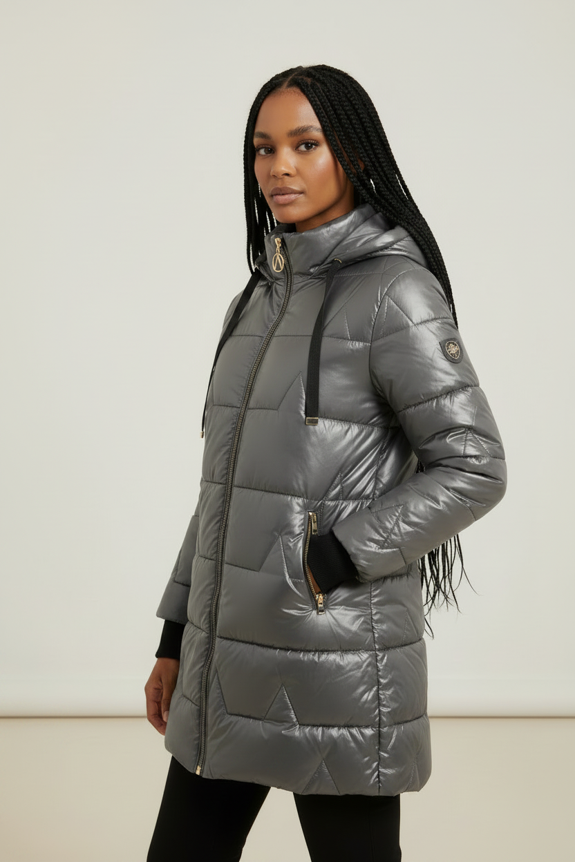 Metallic gray longline puffer coat with quilted padding, drawstring hood, and full-length zip front.