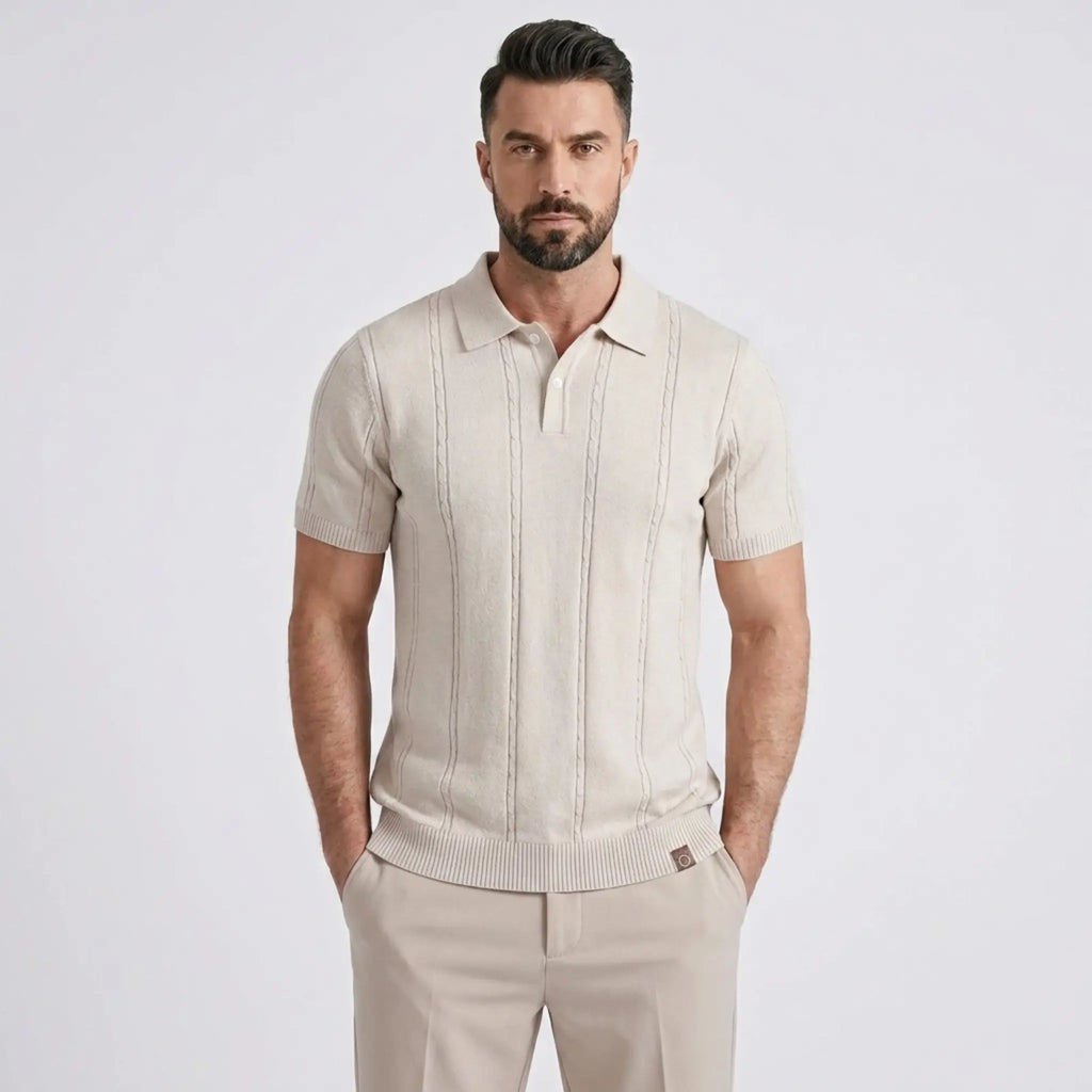 Close-up of a man wearing a beige short-sleeve knit polo shirt with a classic collar.