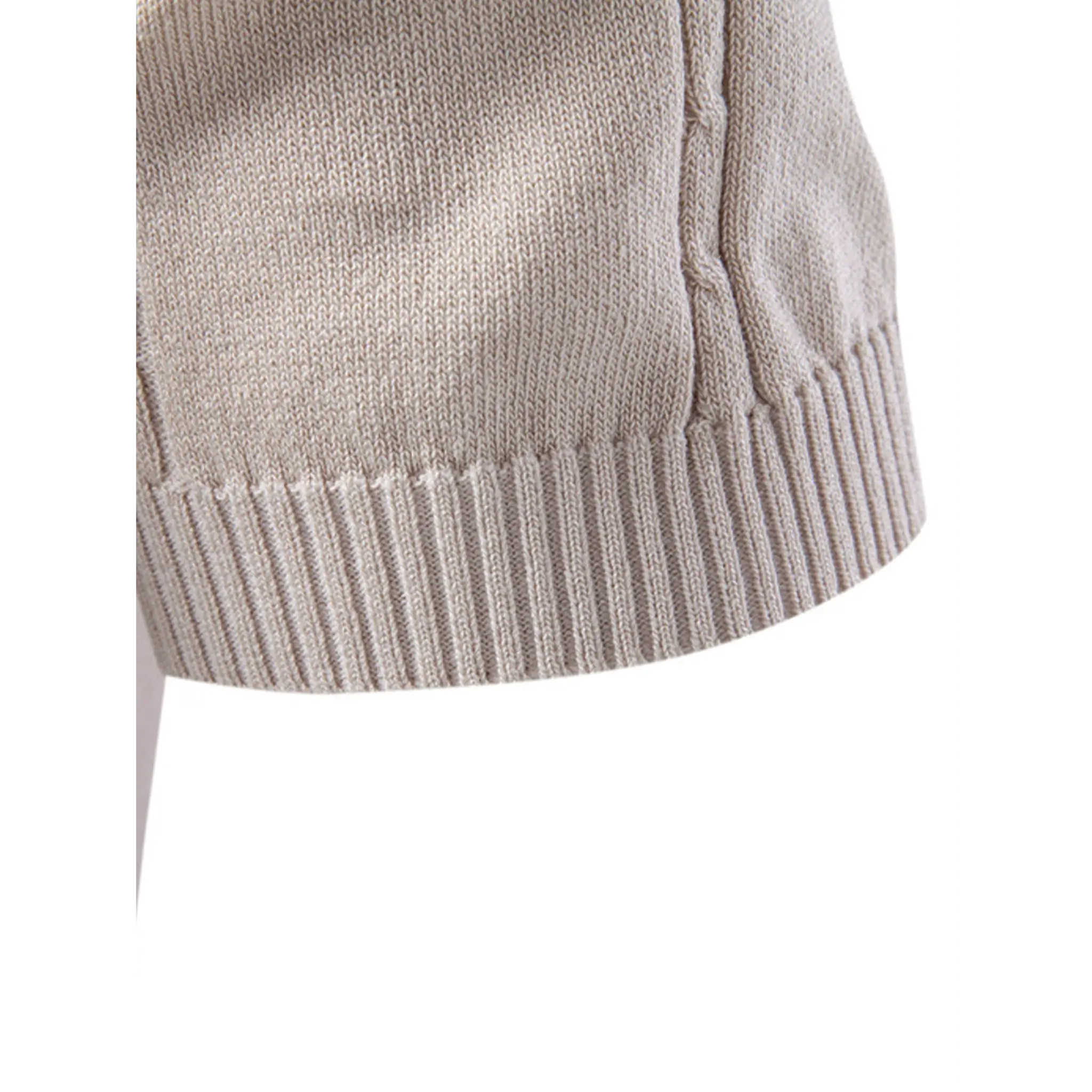 Close-up of the beige knit polo shirt ribbed hem showcasing the premium knit texture.