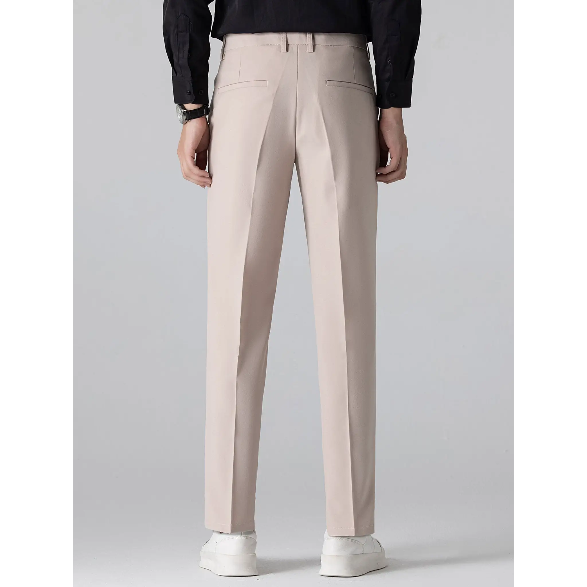 Men's beige straight-leg trousers with a tailored fit displayed on a white background.