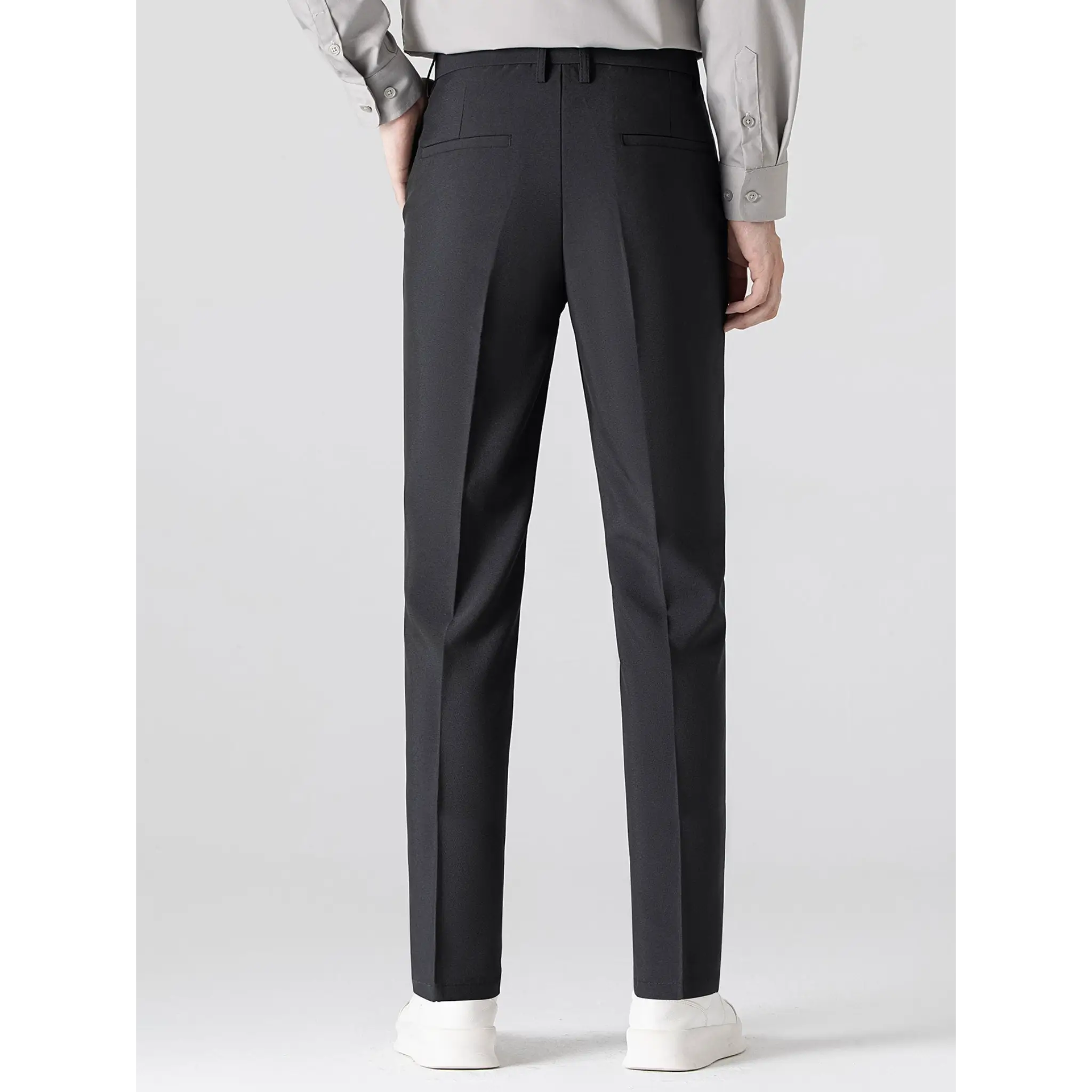 Back view of men's black tailored trousers with a clean straight-leg silhouette.