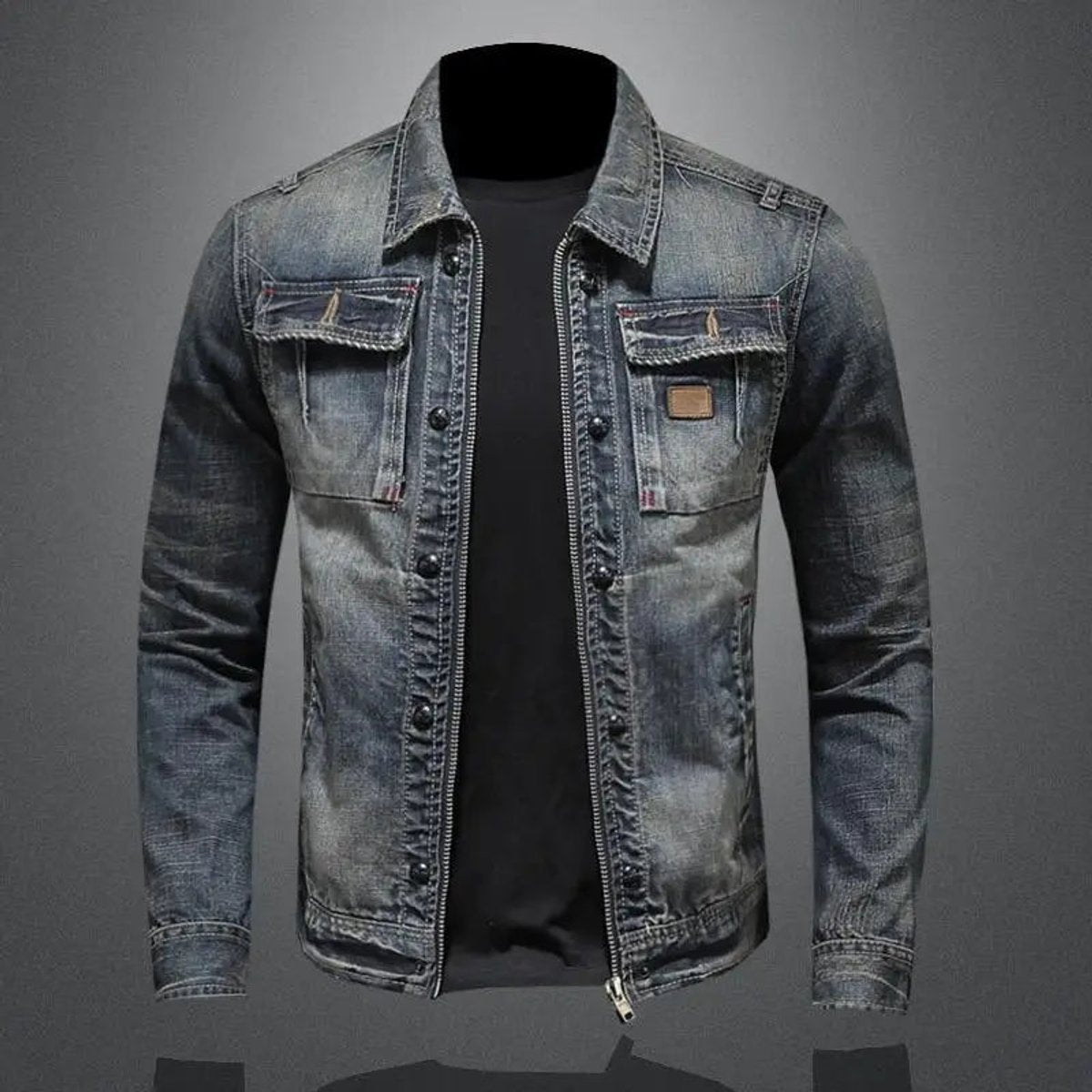 Men's vintage wash denim jacket with a button-front closure, chest flap pockets, faded finish, and regular-fit silhouette over a black T-shirt.