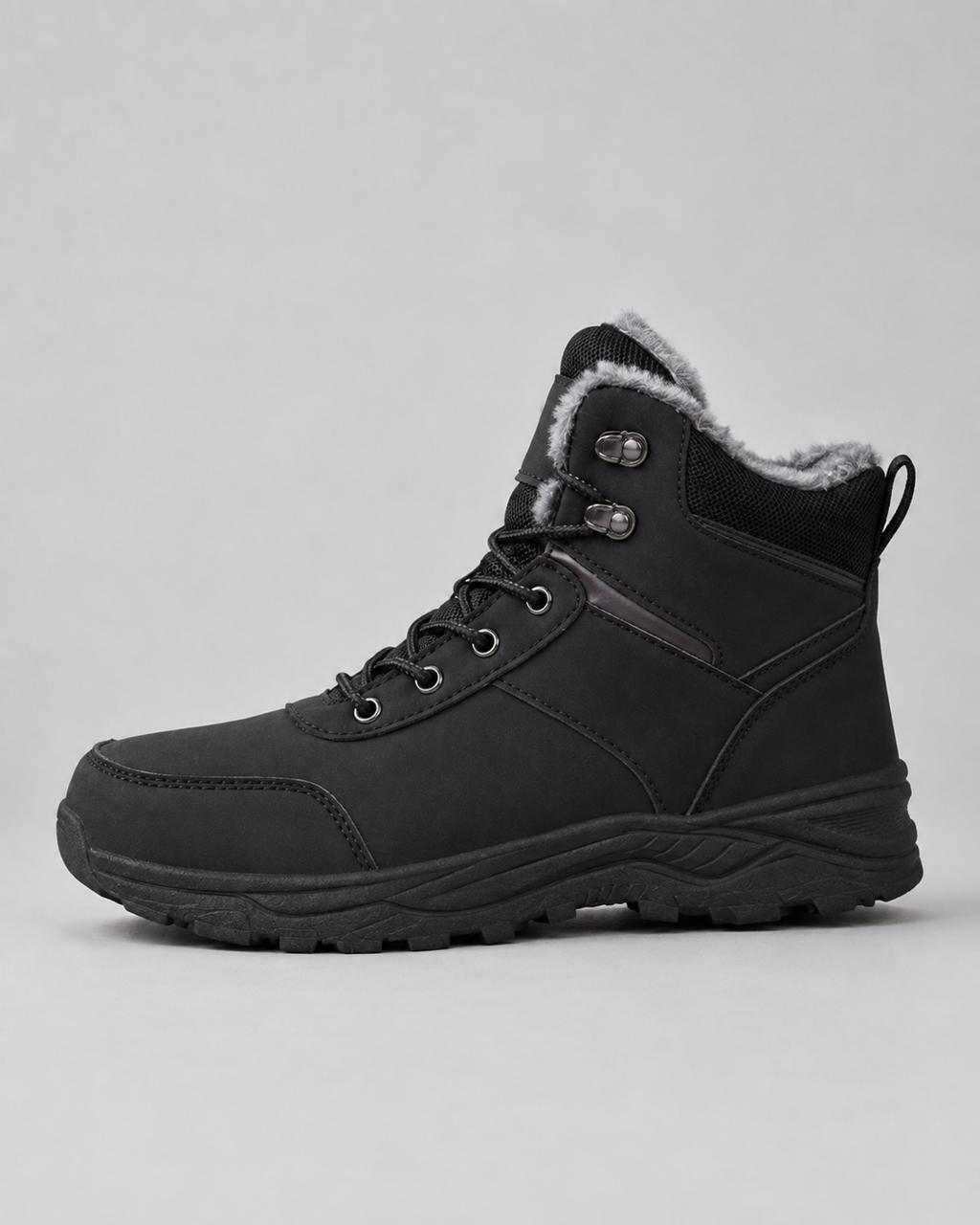 Black lug sole ankle boot with a plush-lined collar and lace-up closure, side view