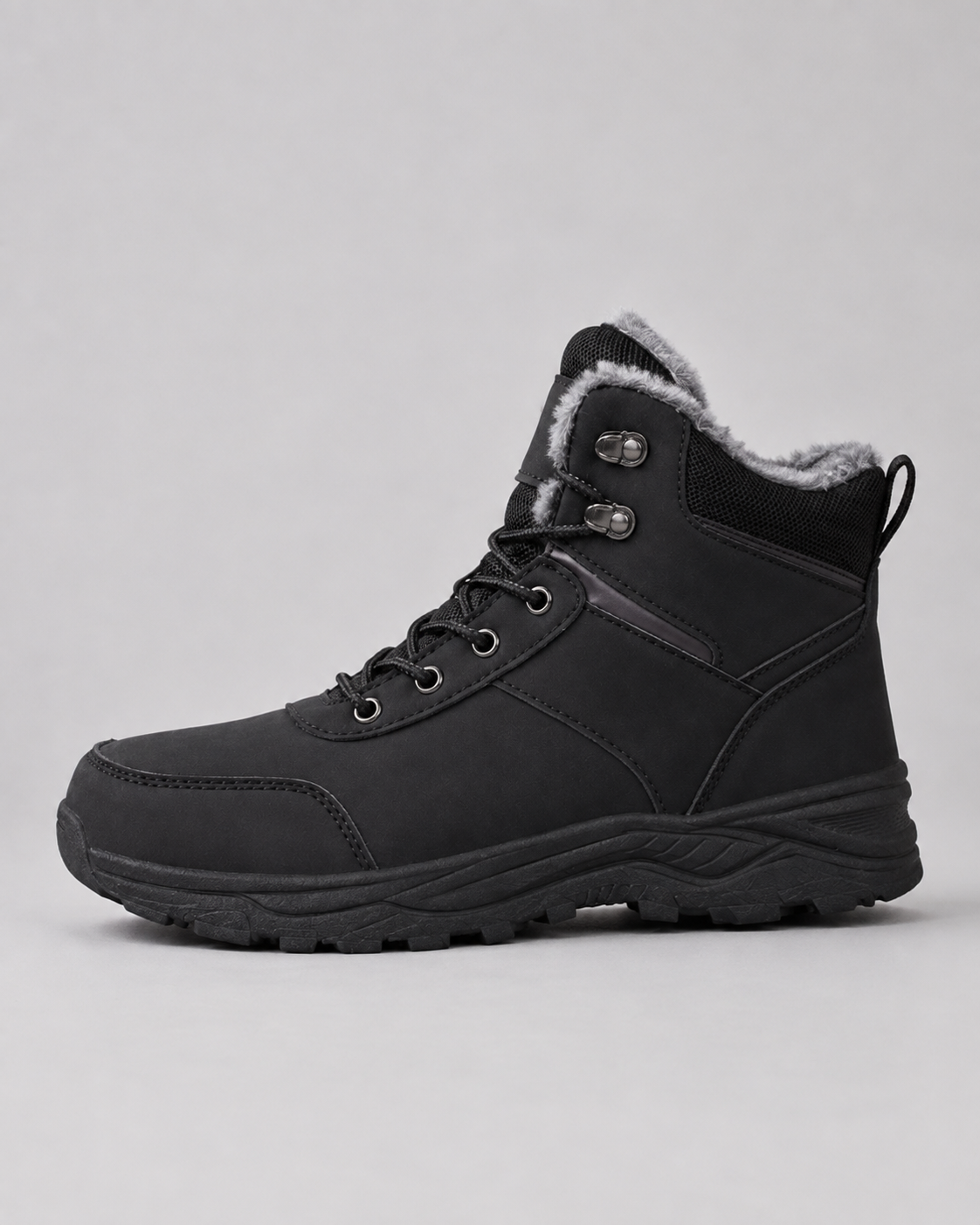 Black lug sole ankle boot with a plush-lined collar and lace-up closure, side view