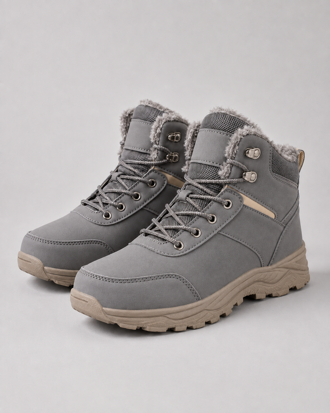 Gray lug sole ankle boots with plush-lined collars and lace-up closures