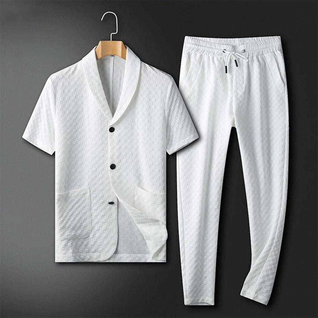 Men's white textured short-sleeve lounge shirt with matching drawstring pants displayed as a lightweight two-piece lounge set.