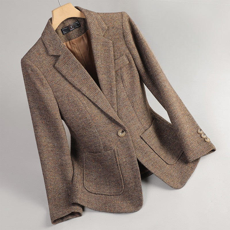 Women's brown tweed blazer with a notched lapel, single-button closure, flap pockets, and tailored silhouette.
