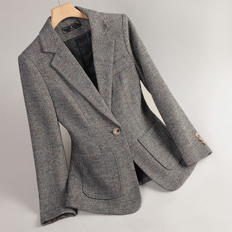 Women's gray tweed blazer featuring a notched lapel, single-button closure, flap pockets, and classic tailored fit.