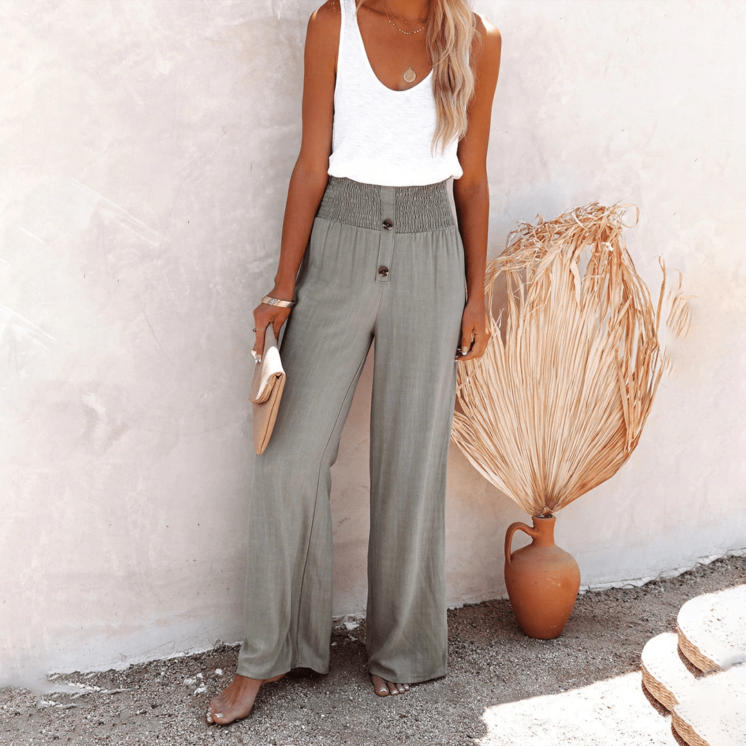 Women's gray high-waisted wide-leg linen pants with front button details, a relaxed fit, and side pockets.