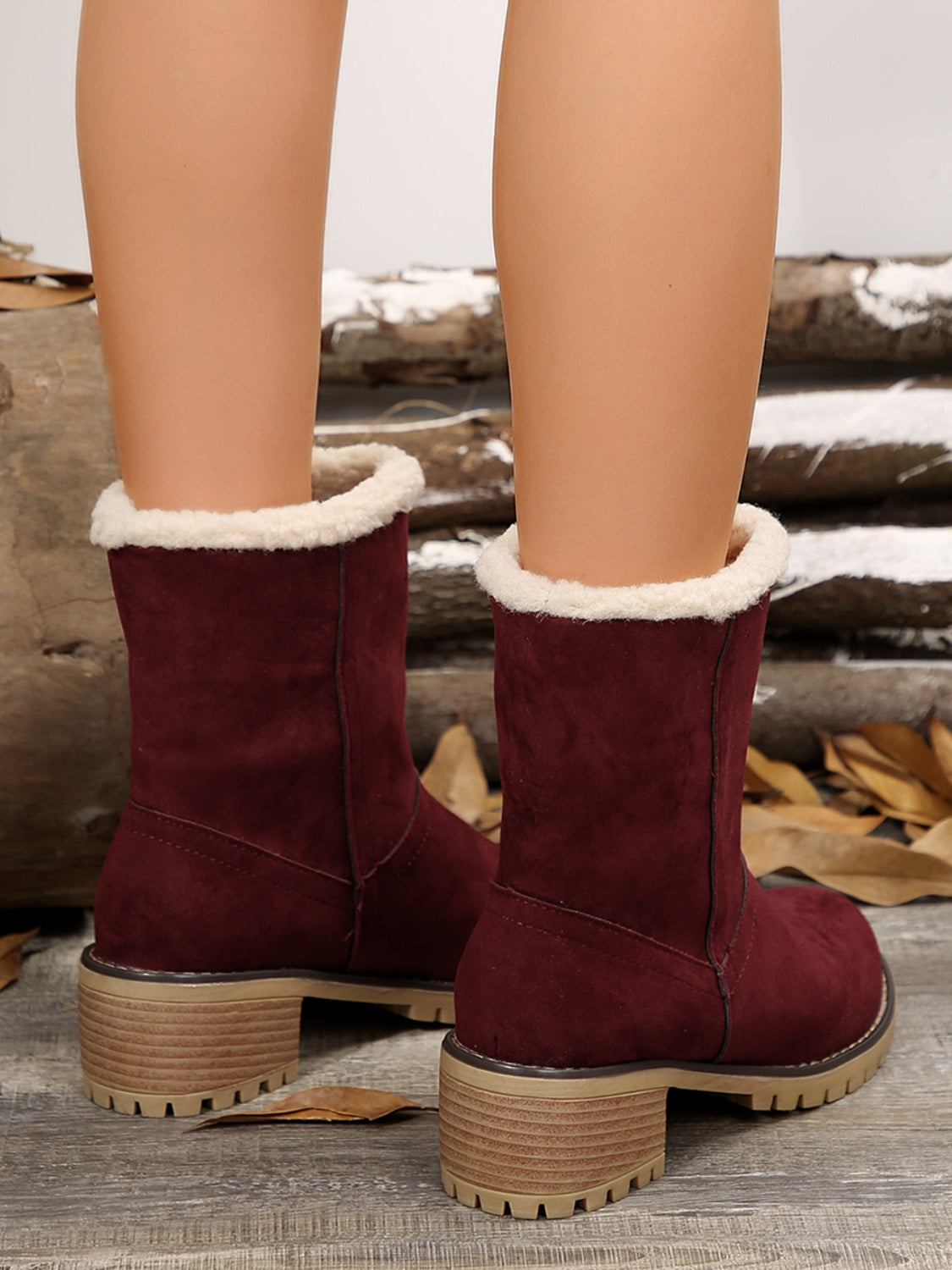 Burgundy mid-calf fuzzy boots for women with block heels and rolled fur cuffs, back view