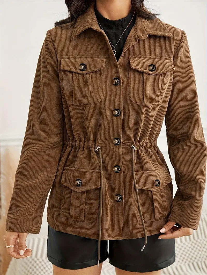 Front view highlighting the button closure, flap chest pockets, long sleeves, and drawstring waist.