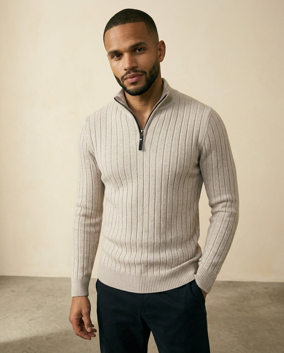 Beige ribbed quarter-zip sweater with a stand collar and soft brushed texture, worn in a regular fit.