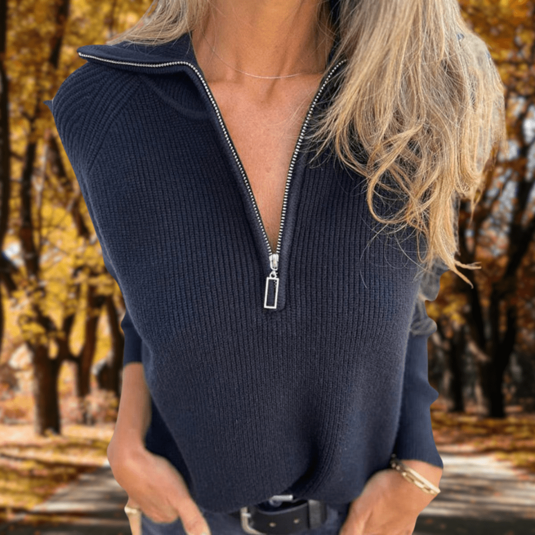 Woman wearing a navy ribbed quarter-zip knit sweater featuring a high collar, long sleeves, and a relaxed fit.