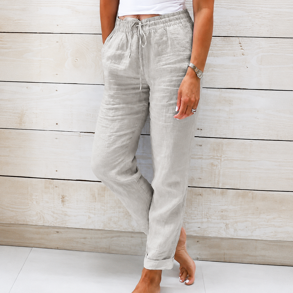 Women's light gray linen drawstring pants featuring a relaxed tapered fit and breathable linen fabric.