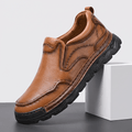 Single brown leather Piolo slip-on loafer with contour stitching and chunky black rubber sole, angled on a white block against a studio backdrop