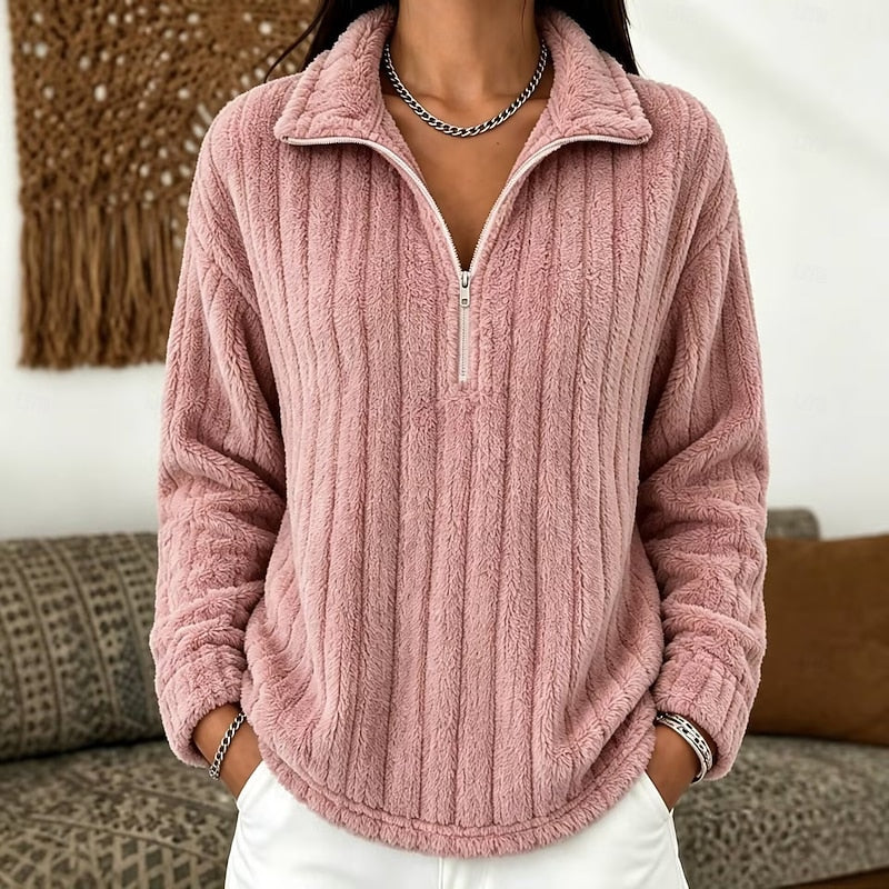 Dusty pink plush ribbed half-zip pullover with a fold-over collar and relaxed drop-shoulder fit.