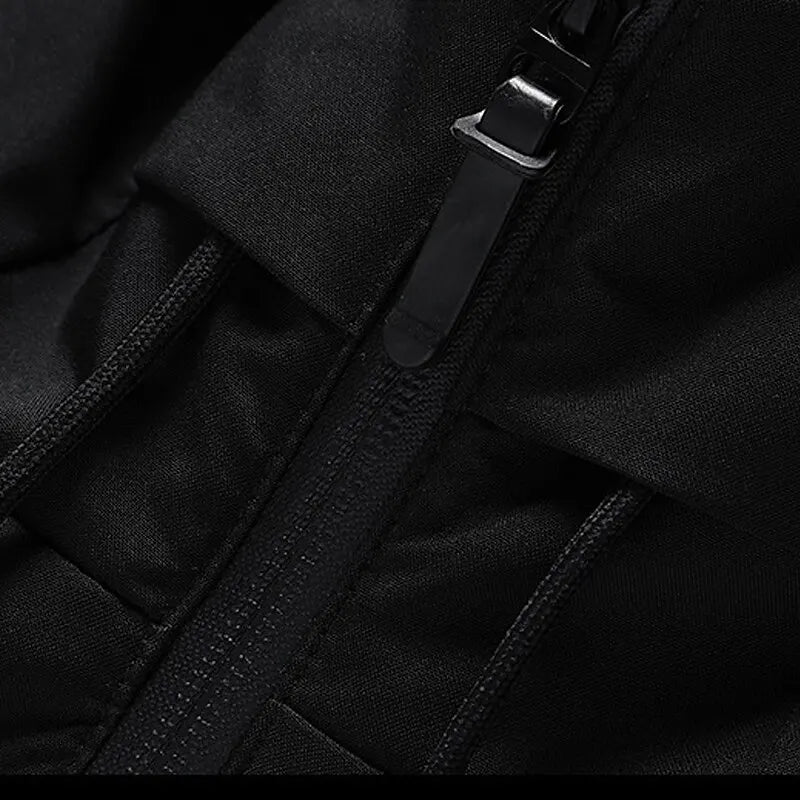 Black quilted puffer jacket detail featuring a matte finish, smooth full-length front zipper, and reinforced seam construction.