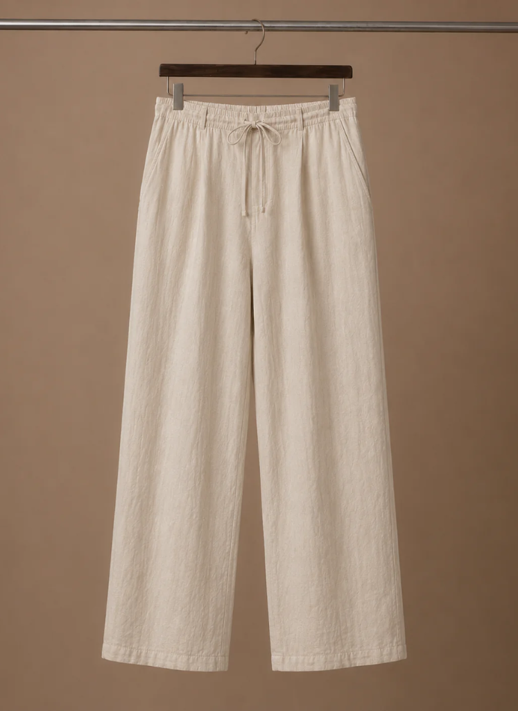 Men's cream linen drawstring pants with a relaxed straight-leg fit displayed on a hanger.