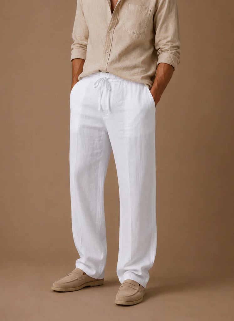 Man wearing light gray linen drawstring pants with a relaxed straight-leg fit and elastic waistband.