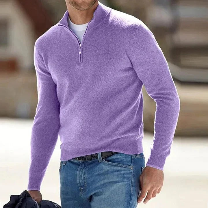 Purple half-zip knit sweater featuring a stand collar and long sleeves, paired with blue jeans in an outdoor setting.
