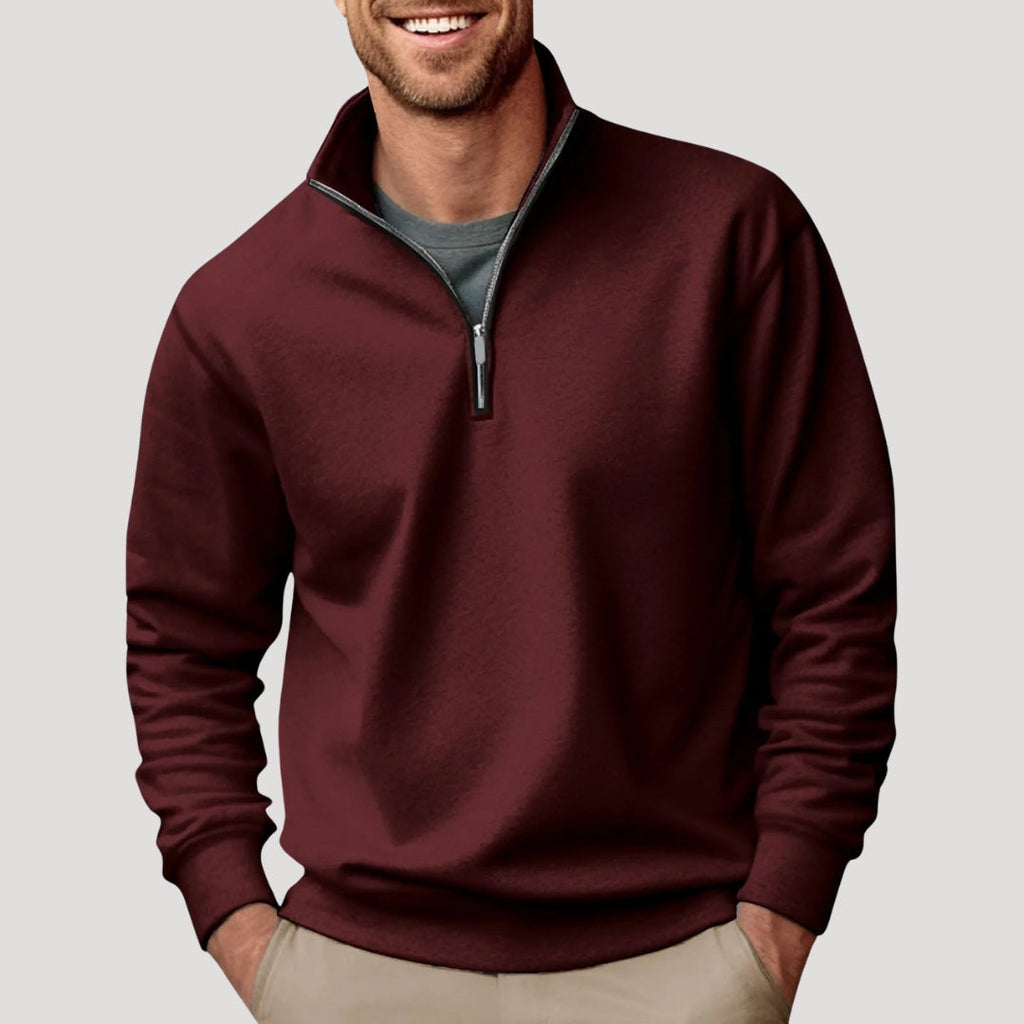 Burgundy relaxed-fit quarter-zip sweater with a soft brushed finish, stand collar, and ribbed cuffs worn over a grey tee.