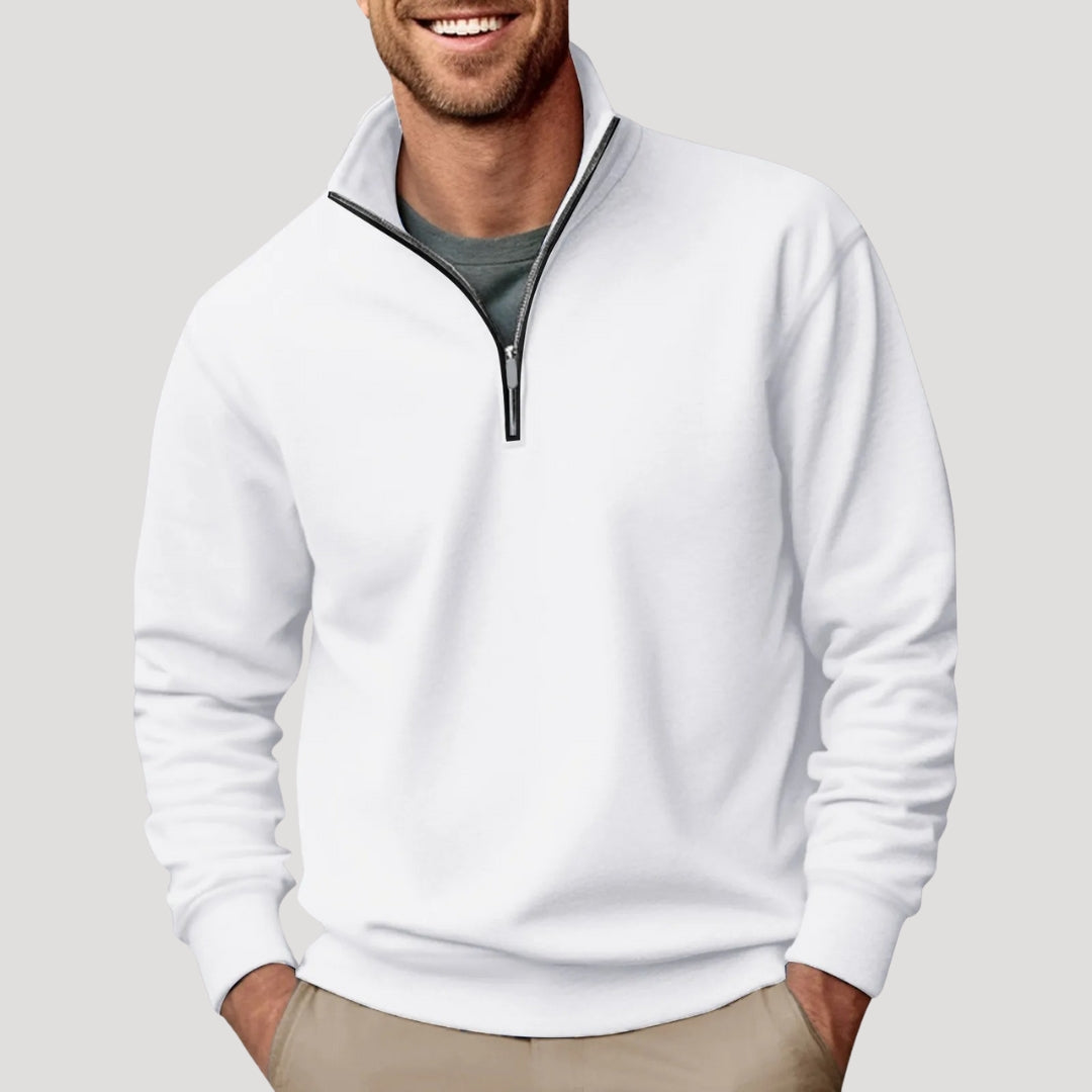 White quarter-zip sweater in brushed fabric with a stand collar, ribbed cuffs, and a relaxed fit worn over a grey tee.