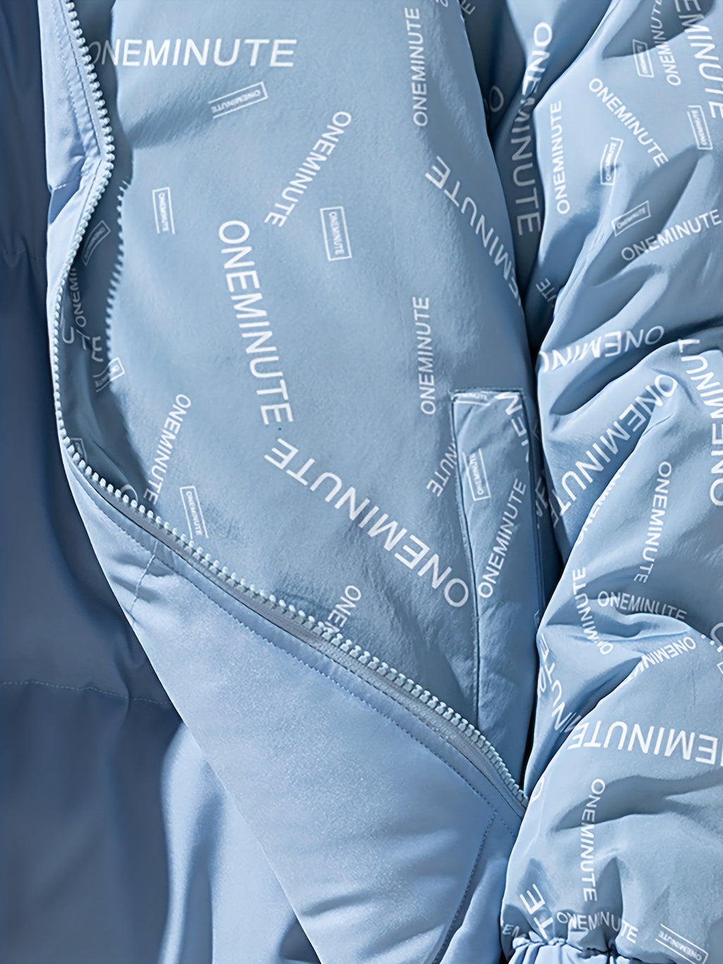 Close-up of the patterned inner lining of a reversible quilted hooded jacket