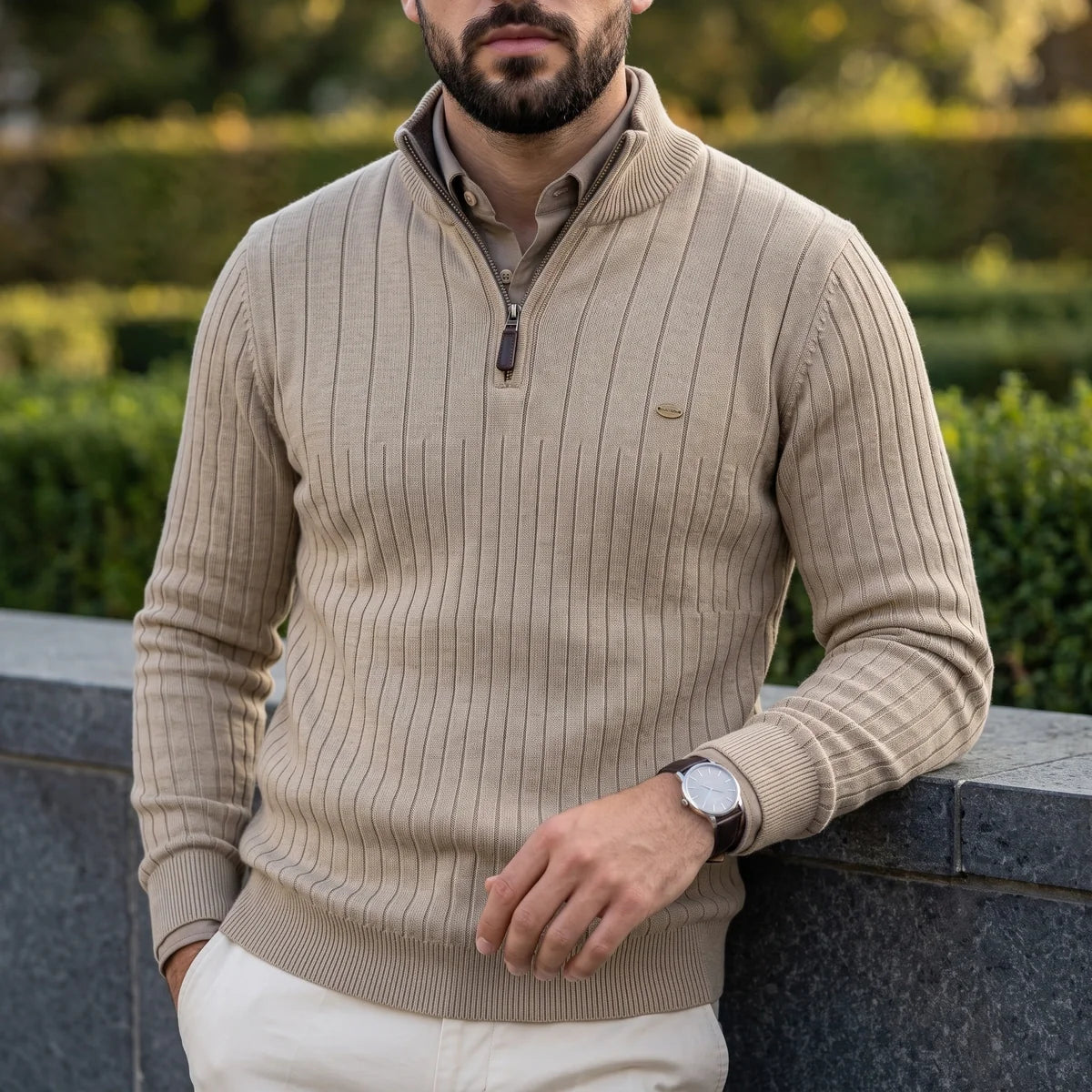 Beige ribbed knit quarter-zip sweater in a cotton blend with a mock neck, layered over a collared shirt in a regular fit.