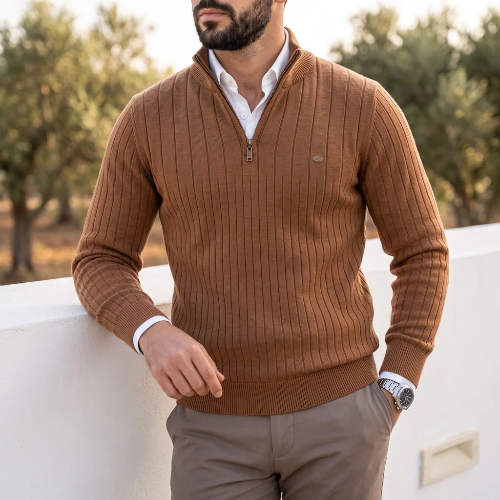 Brown ribbed knit quarter-zip sweater in a cotton blend with a mock neck, layered over a white collared shirt.