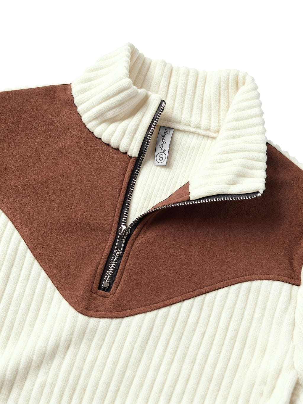Cream ribbed knit quarter-zip sweater featuring a brown suede-look colorblock yoke and a stand collar.